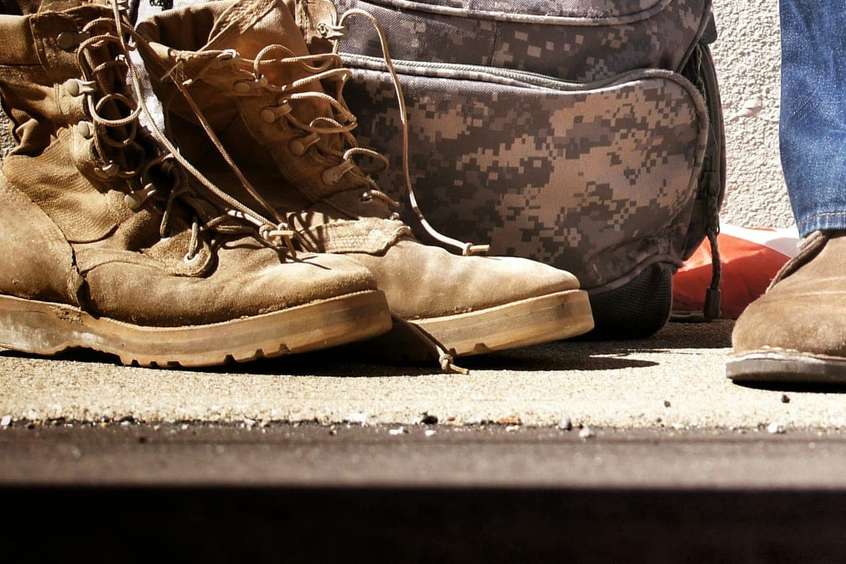 Boots and a packed bag by the door the night before shipping out